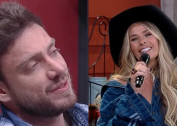 Em A Fazenda, Vini Buttel ouve Adriane Galisteu dar informações privilegiadas. (Foto: Reprodução)